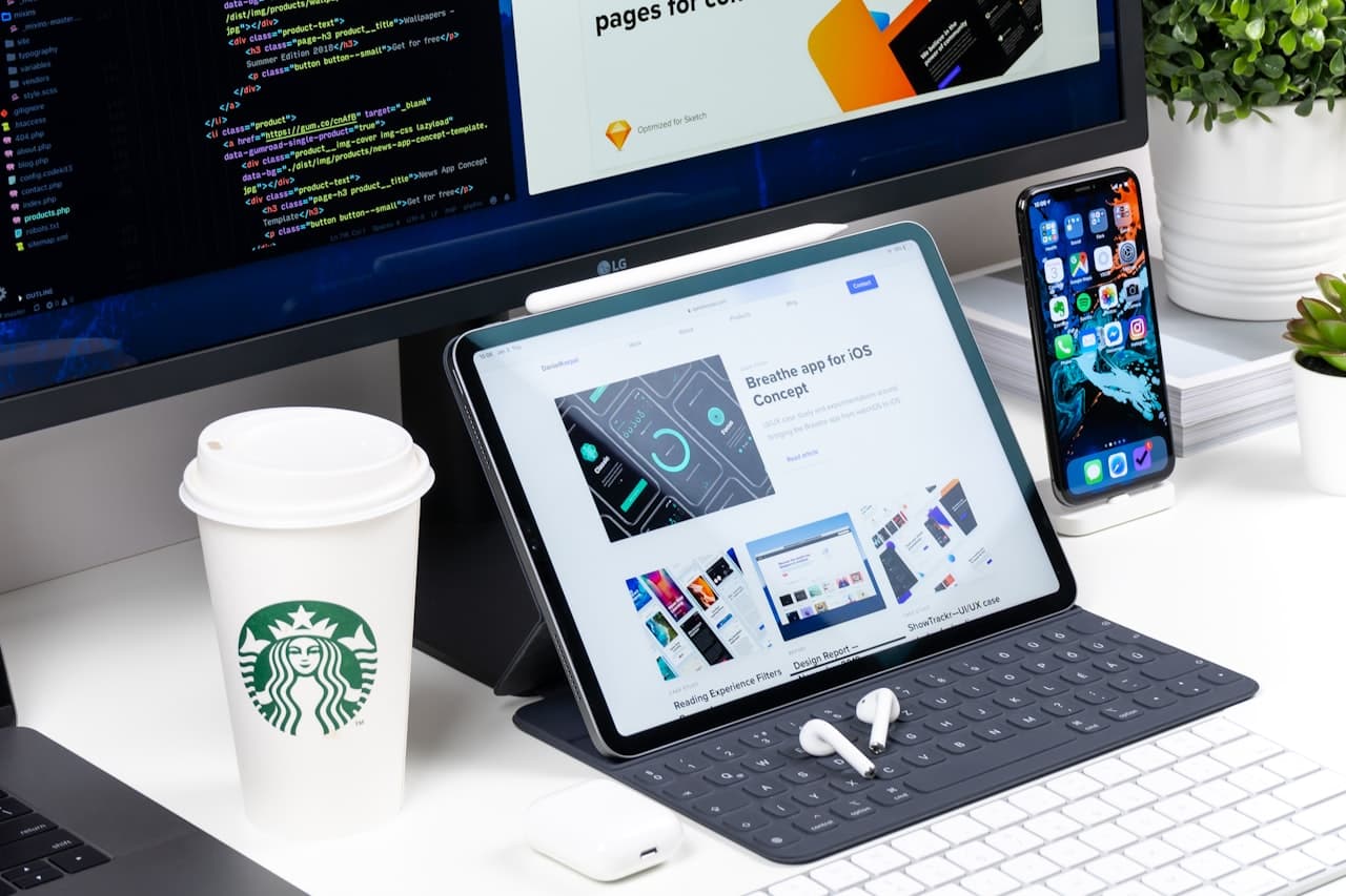 Code editor with a responsive website on monitor, tablet and phone — website development company in Chandigarh